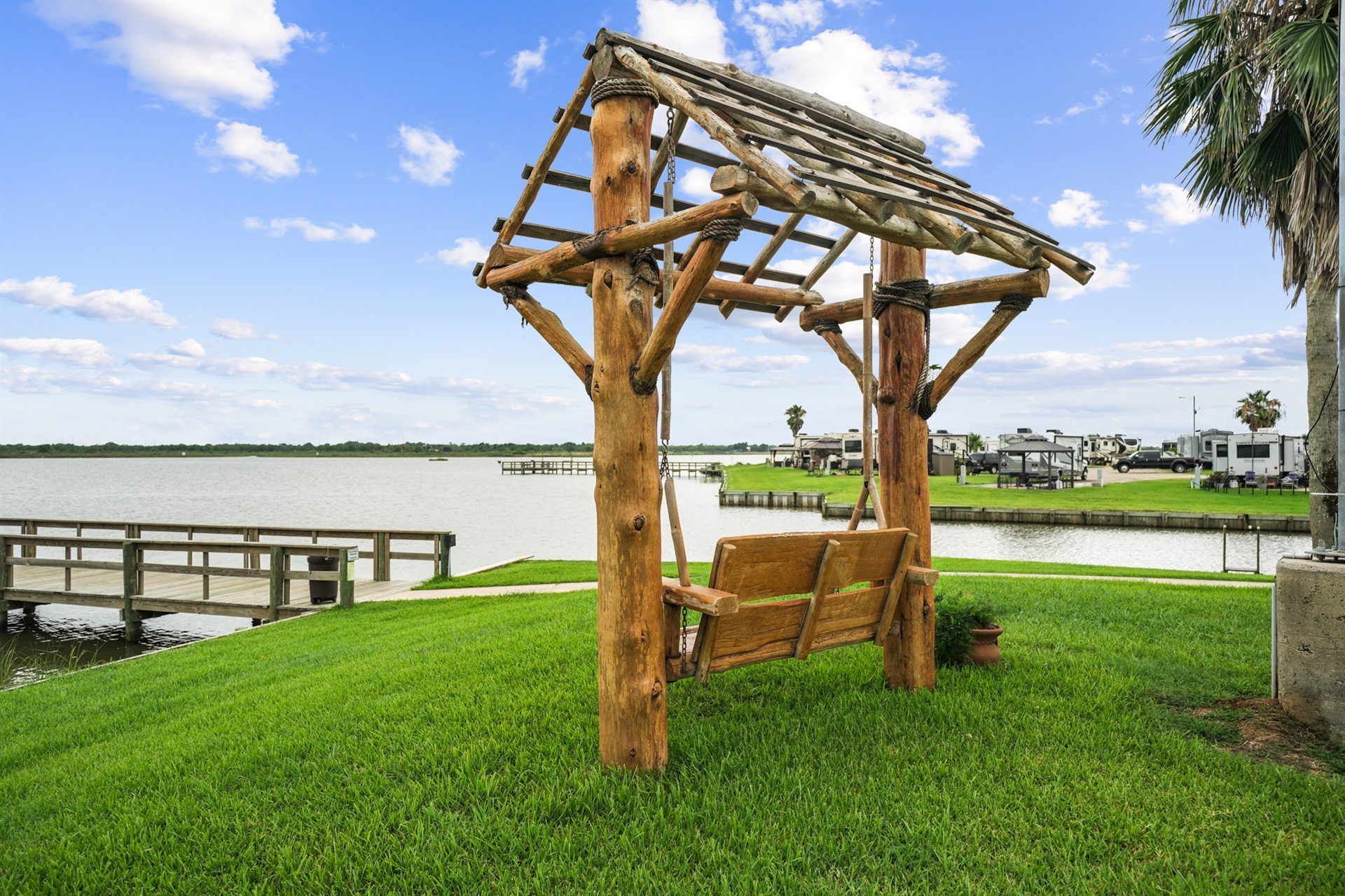 Handcrafted Cedar Glider Swing on Shaded Waterfront Grounds Overlooking Dickinson Bayou