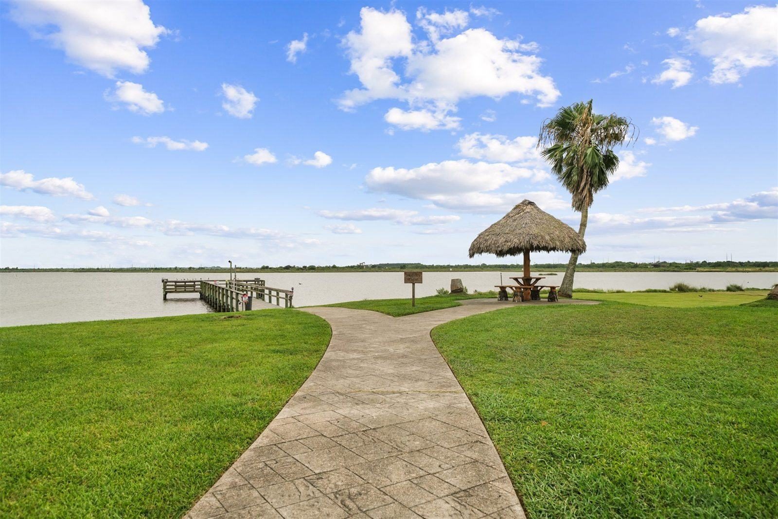 Waterfront Concrete Walkway Leading to Shaded Palapa & Lighted Fishing Pier (Guests Only)