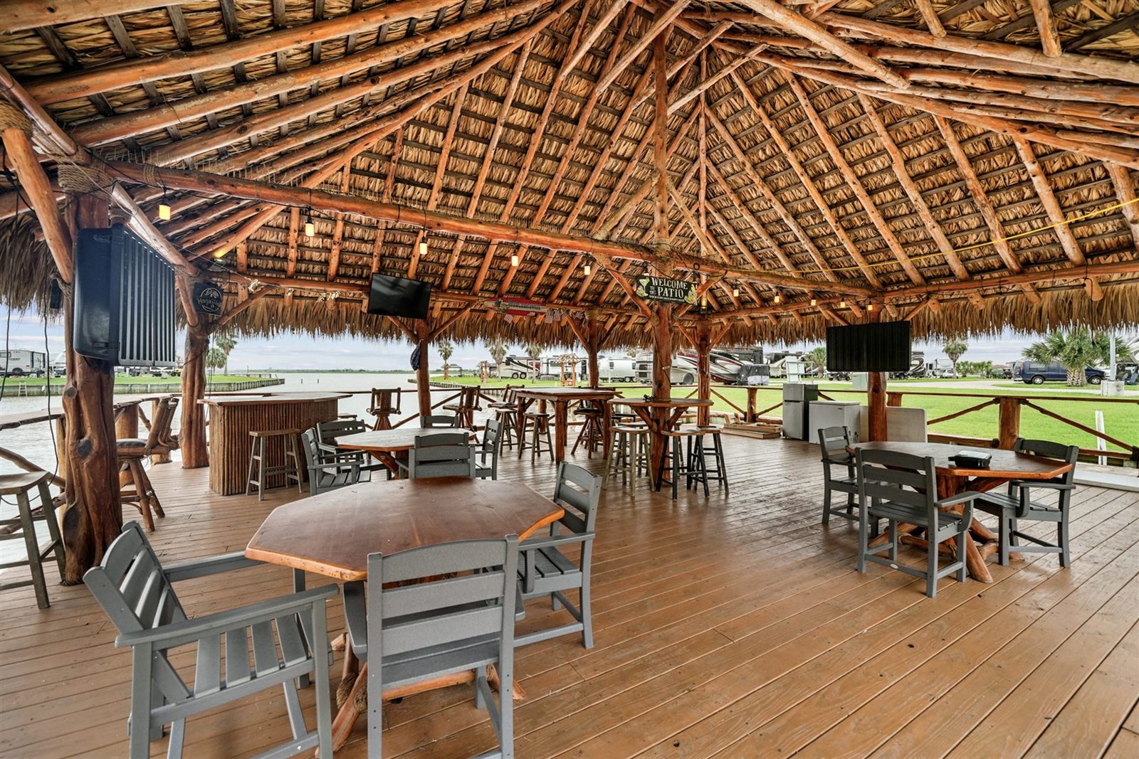 Thatched Palapa Open-Air Patio Deck with Handcrafted Cedar Bar & Waterfront Views