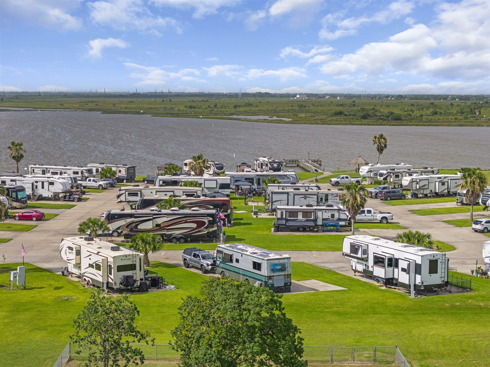 Waterfront RV Sites with Reinforced Concrete Pads & Palm Trees on Dickinson Bayou