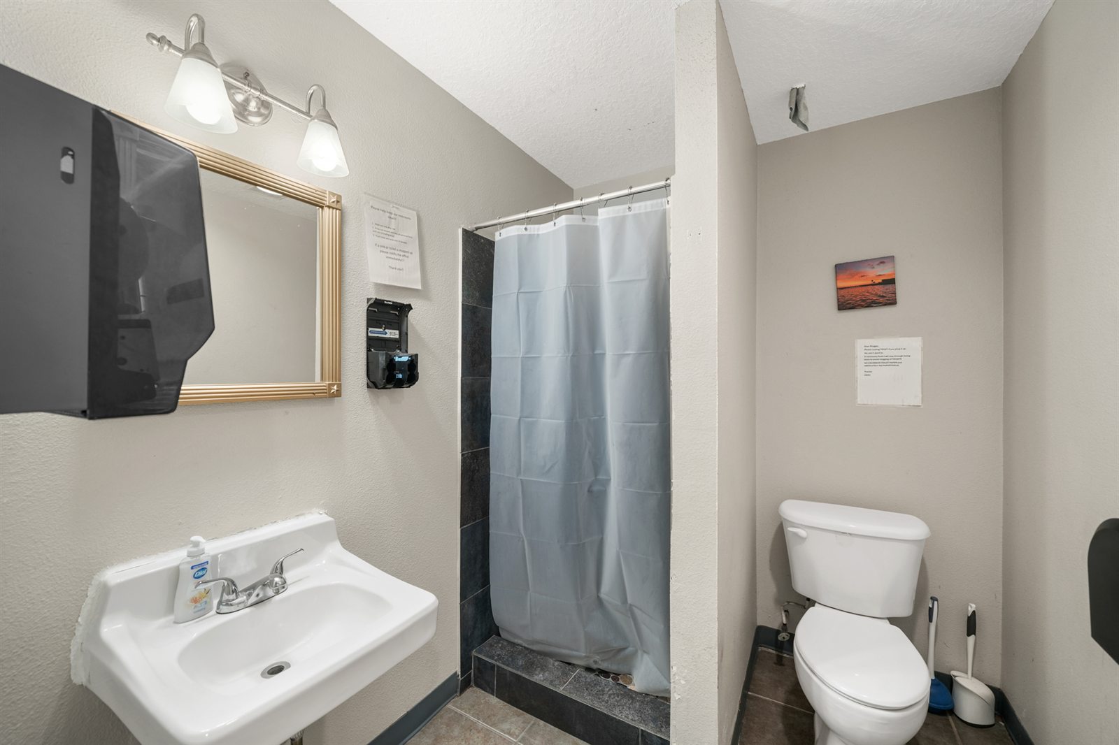 Spotless private shower suite with modern tile and vanity